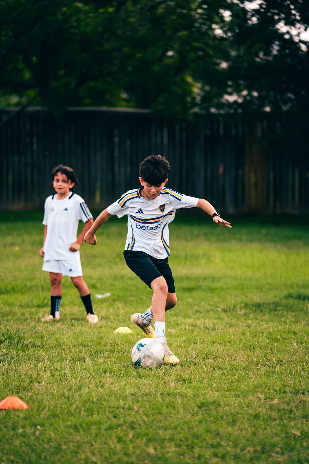 A young player working a cone dribbling drill at Untapped Talent Academy