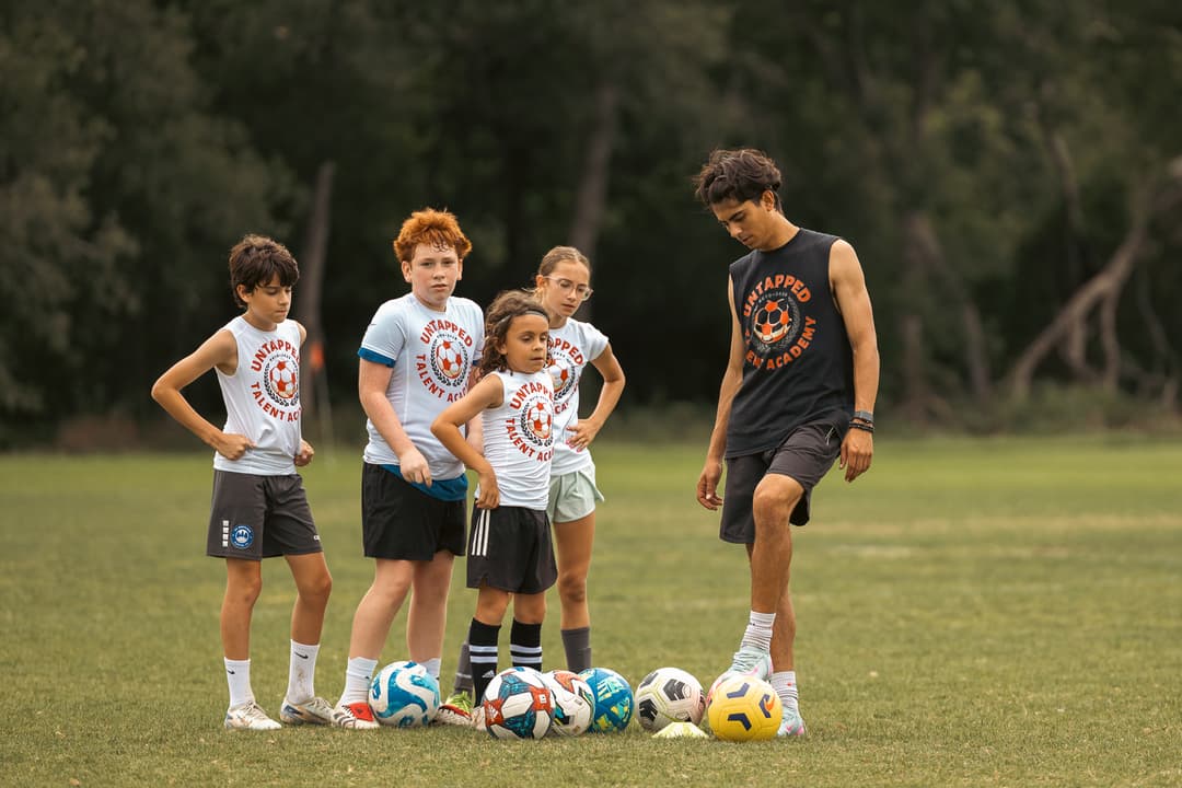 A player training with an Untapped Talent Academy coach